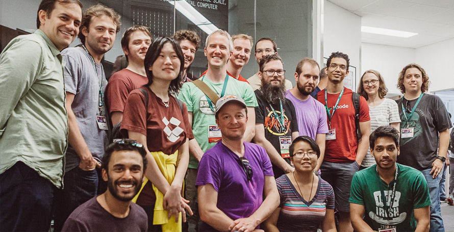 DjangoCon US attendees smiling for a picture.